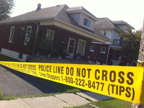 Police tape cordons off a home in the 500 block of Oak Avenue last Friday, while police investigated the second murder of the year in Windsor.