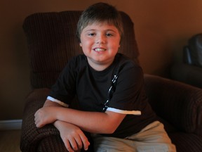 Tory Provenzano, 10, has a severe form of muscular dystrophy. The family hosts a golf tournament every year to raise money for research. Tory is also part of a clinical trial in London where researchers are trying to find a way to slow the progression of the disease. He is pictured Thursday, July 26, 2012, at his LaSalle, Ont. home. (Windsor Star / DAN JANISSE)