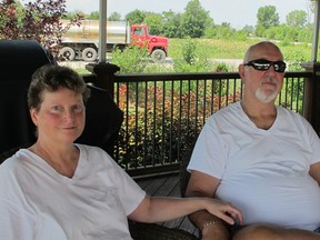 Susan and Richard Garrick bought their home at Puce and Wall roads in Lakeshore, Ont., in 1999, three years after the Maidstone landfill closed. The recent traffic of trucks hauling dirt to the landfill is a 'nightmare,' Susan Garrick said on Monday, July 30, 2012. (The Windsor Star-Monica Wolfson)