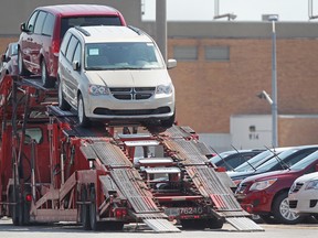 A truck is loaded up with Chrysler Minvans at the Chrysler automotive plant on Walker Road, Friday, July 6, 2012. (DAX MELMER/The Windsor Star).