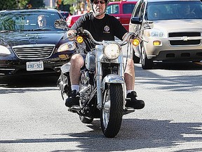 A rider turns his Harley from Park Street East to Ouellette Avenue Friday July 20, 2012. The issue of loud motorcycles will be discussed at City Council on Monday. (NICK BRANCACCIO/The Windsor Star)