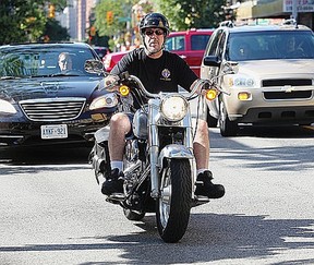 A rider turns his Harley from Park Street East to Ouellette Avenue Friday July 20, 2012. The issue of loud motorcycles will be discussed at City Council on Monday. (NICK BRANCACCIO/The Windsor Star)