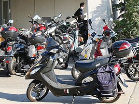 In this file photo, about of dozen E-bike are shown parked outside of City Hall Square, Monday, July 23, 2012, in Windsor, Ont. On the agenda for city council was the regulations regarding e-bikes.  (Windsor Star / DAN JANISSE)