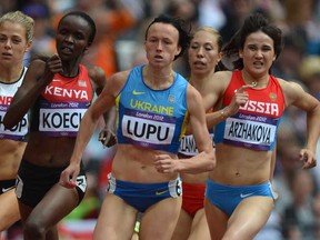Former Windsor Lancer Canada's Melissa Bishop, from left, Kenya's Cherono Koech, Ukraine's Nataliia Lupu and Russia's Elena Arzhakova race in the women's 800m heats at the Olympic Games Aug. 8, 2012, in London. (EISELEJOHANNES EISELE/AFP/GettyImages)