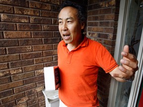 Andy Jun of Tecumseh, Ont., was already out the door to have his computer tablet delivered following a deal he struck with a customer on Kijiji, but he just didn't feel right about the website he visited and text messages he received to consummate the deal, Aug. 21, 2012.  After revisiting the site, he realized the deal was a scam and he notified police. (NICK BRANCACCIO/The Windsor Star)