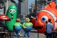 Balloonapalooza inflatables Tweedledee and Tweedledum dance on the street on Ouellette Avenue between Pitt Street and Riverside Drive August 3, 2012. Balloonapalooza, the giant cold air balloon festival is planned for August 25-26. (NICK BRANCACCIO/The Windsor Star)