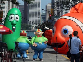 Balloonapalooza inflatables Tweedledee and Tweedledum dance on the street on Ouellette Avenue between Pitt Street and Riverside Drive August 3, 2012. Balloonapalooza, the giant cold air balloon festival is planned for August 25-26. (NICK BRANCACCIO/The Windsor Star)