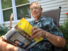 Retired Dr. Roger Scott is concerned that his phone number as well as many of his friends are not listed in the Bell Canada phone book. He is pictured Monday, Aug. 20, 2012, at his Windsor, Ont. home.  (DAN JANISSE/ The Windsor Star)