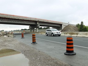 A vehicle makes its way under the North Talbot Road overpass at Highway 401 in Windsor  on August 27, 2012. (The Windsor Star / TYLER BROWNBRIDGE)
