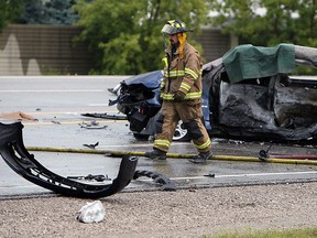 Emergency services personel work at the scene of a fatal accident at the corner of County Row 22 and Lesperance Road in Tecumseh on Tuesday, August 21, 2012. (The Windsor Star / TYLER BROWNBRIDGE)