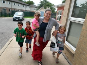 Christine Winter brings her children, Piper, 2, Gavin, 7, left, twins Broden and Hailey, 6, right, to the CAW Community Child Care Centre on Ken Gerard Court  in Windsor, Ont., Thursday, August 16, 2012,  (NICK BRANCACCIO/The Windsor Star