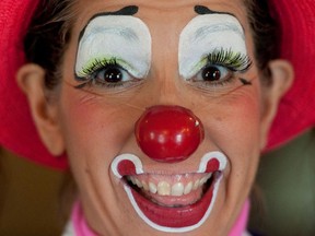 In a July 31, 2012 photo, Julie Varholdt, aka "Lovely Buttons," poses for a portrait at the third annual Clown Campin' in Ontario, Calif. The week long event is held for clowns across the United States and Canada to learn, get inspired, and network. (AP Photo/Grant Hindsley)