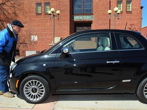 A man checks out a Fiat 500 in this file photo. (Nick Brancaccio/The Windsor Star)