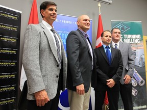 In this file photo, FedDev Ontario announced investments of $2,116,250 to three local businesses Friday, Aug. 10, 2012, in Windsor, Ont. Dino Civiero, (L), president of Technicut Tool Inc.,  MP Jeff Watson, Scott Mahler, of Lakeshore Fixture and Gauge and Jim Tracey, representing Contract Glaziers pose for a photo after the announcement. (Windsor Star / DAN JANISSE)