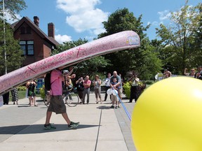 Andrew Metcalfe, 21, arrives at Windsor city hall on August 1, 2012 in Windsor, Ontario after finishing his journey across Ontario  with a pink canoe to raise awareness and funds for the Canadian Cancer Society. He arrived in Windsor on Wednesday afternoon to much fanfare and applause. (JASON KRYK/ The Windsor Star)