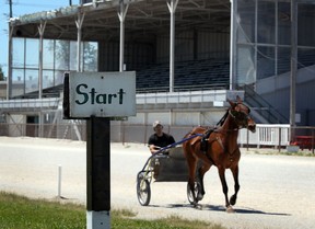 Harness horsemen Greg Price takes Cams Matters for a training jog around Leamington Fairgrounds Wednesday, June 13, 2012. (NICK BRANCACCIO/The Windsor Star)