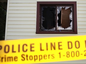 A broken window is pictured after a late night house fire at 959 Rankin Ave. in Windsor, Ont., Sunday, August 26, 2012.  The fire has been confirmed as arson.. (DAX MELMER/The Windsor Star)