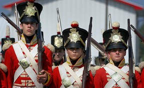 A period group dressed as soldiers from the 1812 era march in the heritage parade at the Roots to Boots Festival celebrating the bi centennial of the war of 1812, in Amherstburg, Ont., Saturday, Aug. 4, 2012. (DAX MELMER/The Windsor Star)