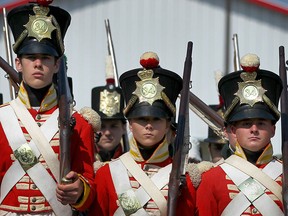 A period group dressed as soldiers from the 1812 era march in the heritage parade at the Roots to Boots Festival celebrating the bi centennial of the war of 1812, in Amherstburg, Ont., Saturday, Aug. 4, 2012. (DAX MELMER/The Windsor Star)