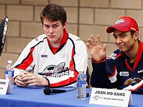 Spits defenceman Patrick Sanvido, left, and Josh Ho-Sang met season ticket holders at the WFCU Centre in April. (TYLER BROWNBRIDGE/The Windsor Star)