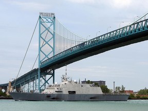 A warship passes under the Ambassador Bridge in Windsor, Ont. on Wednesday, Aug. 8, 2012.  (The Windsor Star / TYLER BROWNBRIDGE)