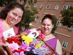 Cousins Natalie Cousineau, left, and Janet Lamoureux, who are selling Peyton Rose and Caitlyn Ashley's Headbands for SIDS, are shown here in Windsor, Ont. Sunday, Aug. 19, 2012.  (DAX MELMER/The Windsor Star)