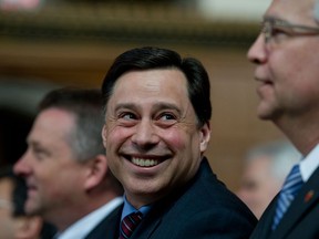 Brad Duguid, left, is the Minister of Economic Development, Employment and Infrastructure.   (National Post files)