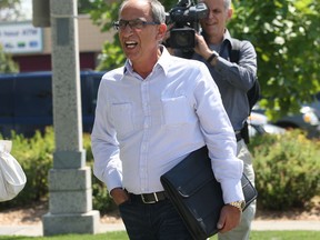 Tony Battaglia arrives at Windsor City Hall, Tuesday, Aug. 21, 2012, in Windsor, Ont. to pay back taxes on the former Grace Hospital site.  (DAN JANISSE/ The Windsor Star)