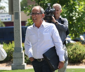 Tony Battaglia arrives at Windsor City Hall, Tuesday, Aug. 21, 2012, in Windsor, Ont. to pay back taxes on the former Grace Hospital site.  (DAN JANISSE/ The Windsor Star)