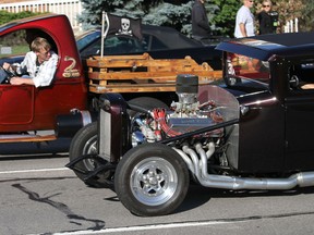 Cars participate at the 18th annual Woodward Dream Cruise on Saturday, Aug. 18, 2012 in Ferndale, Mich. (AP Photo/Detroit Free Press, Jessica J. Trevino)