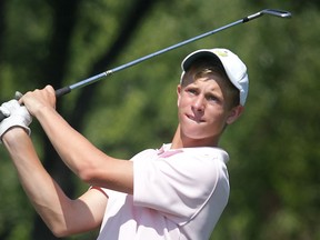 Kingsville's Devan Schulert hits a shot during the Essex-Kent Boys Golf Tournament Wednesday at Roseland. (DAN JANISSE/The Windsor Star)