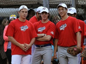Spitfires forwards Kerby Rychel, from left, Michael Clarke and Jordan Maletta played in a softball game against local media at Riverside Baseball Centre earlier this month. (TYLER BROWNBRIDGE/The Windsor Star)
