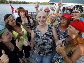 WINDSOR, ONT. AUGUST 30, 2012 --  Janice Moroun, centre,  surrounded by her close friends after she has completed 3 months of chemotherapy August 30, 2012. Joining Moroun on a beautiful evening were Kerri Nowosad, left, Denise Parent, Kim McDonald, Betty Gangnon, Pat Callen, host Mar Chapman, Lorrie Stephenson and Catherine Murphy, front right.  Melissa Compton, hidden, behind right.  (NICK BRANCACCIO/The Windsor Star)