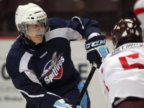 Spits forward Bron Loiselle, left, makes a move in front of Jack Billings during the annual Blue-White exhibition game at the WFCU Centre. (NICK BRANCACCIO/The Windsor Star)