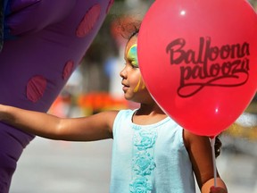 WINDSOR, ONT.:AUGUST 26, 2012 -- Sirisha Naidoo, 4, pokes at a jazz playing fish balloon while at the 2nd annual Balloonapalooza in downtown Windsor, Sunday, August 26, 2012.  (DAX MELMER/The Windsor Star)