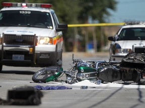 A motorcycle lies on its side after it was struck by a mini van at the intersection of George Avenue and Wyandotte Street east, Monday, August 6, 2012.  (DAX MELMER/The Windsor Star)