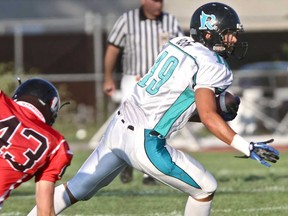 Essex's Dallas Boow, right, runs past Mississauga's Daniel Samyn during OVFL playoff action at Raider Field in Essex Saturday, July 28, 2012. (REBECCA WRIGHT/ The Windsor Star)