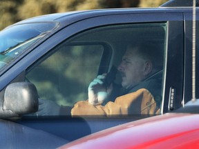 A motorist talks on a cell phone while driving in south Windsor in this 2010 file photo. (NICK BRANCACCIO/The Windsor Star)