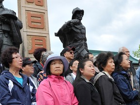 Demonstrators gather at the monument to Chinese-Canadian war veterans and railway workers in Vancouver, B.C. in this July 2011 file photo. (Jason Payne / PNG)