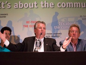 In this file photo, Canadian Auto Workers president Ken Lewenza, centre, speaks at a press conference flanked by assistant to the CAW president Jerry Dias, left, and national secretary treasurer Peter Kennedy following contract talks with General Motors in Toronto on Aug.14, 2012. (Michelle Siu/THE CANADIAN PRESS)