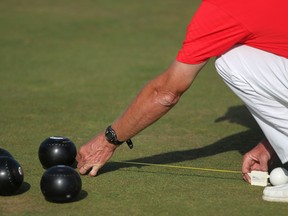 WiINDSOR, ONT.:AUGUST 1, 2012 -- Umpire Jim Chlite measures a ball to the jack in the gold medal match in the Seniors Lawn Bowling Championships at the Windsor Lawn Bowling Club, Wednesday, August 1, 2012. (DAX MELMER/The Windsor Star)