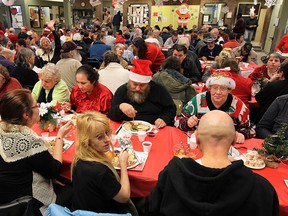 People enjoy a feast at the Downtown Mission in this file photo. (Tyler Brownbridge/The Windsor Star)