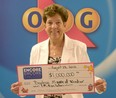Beatrice Moore accepts her cheque for $1-million from the OLG.