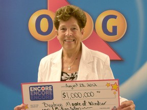 Beatrice Moore accepts her cheque for $1-million from the OLG.