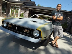 Evan Suntres, a University of Windsor master's student, is photographed with his 1973 Ford Mustang at his home in Windsor on Tuesday, August 7, 2012. Suntres is writing his thesis on muscle cars and their relationship to their owners.         (The Windsor Star / TYLER BROWNBRIDGE)