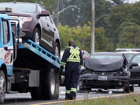 An SUV is loaded onto a flatbed truck after a two vehicles were involved in a collision on E.C. Row Expressway, east of Central Avenue, Thursday, August 9, 2012. (DAX MELMER/The Windsor Star)