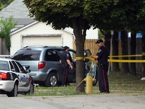 Windsor police investigate at Drouillard Park in Windsor on Wednesday, August 8, 2012. Police responded to a call for a person in distress. One person was transported to hospital.           (The Windsor Star / TYLER BROWNBRIDGE)