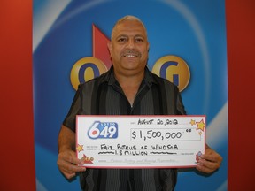 Faiz Putrus, 50, of Windsor, displays his cheque for $1.5 million after matching six of six numbers in the Aug. 15 Lotto 6/49 draw. He picked up his prize in Toronto on Monday.