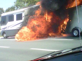 A Winnebago blaze mangled traffic on Highway 401 near Highway 3 on Wednesday, Aug. 1, 2012. (Kristie Colautti/For The Windsor Star)