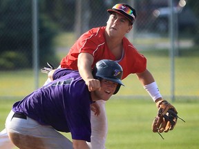 Joel Cooper, top, of the Windsor Junior Selects and Andrew Cooper of the Tecumseh Junior Thunder get tangled up at second base during Can-Am Senior League action at Lacasse Park in Tecumseh, Ont. Friday, July 6, 2012. (Windsor Star / DAN JANISSE)